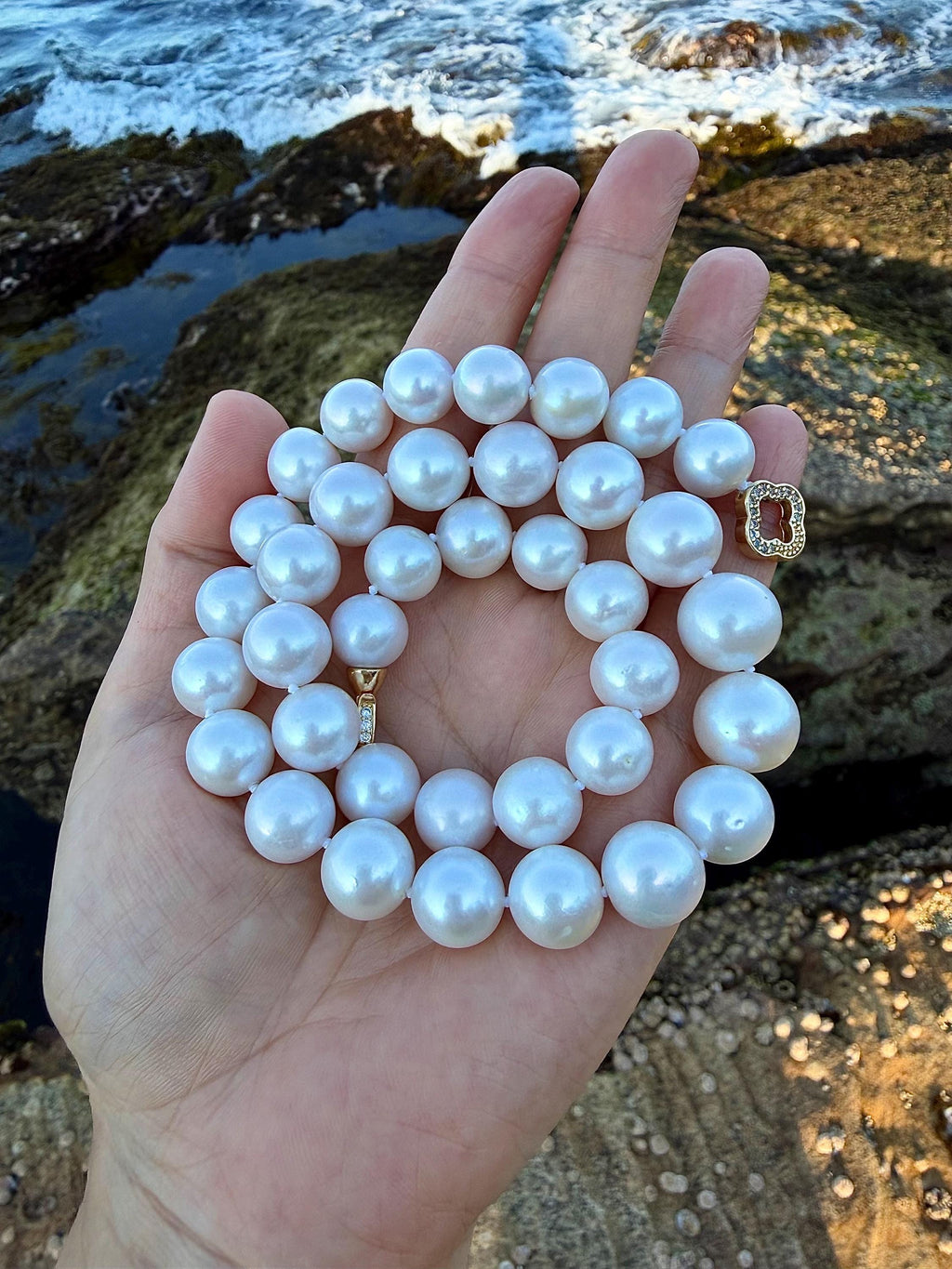 All-nacre pearl necklace with round light blue pearls and gold-tone clasp