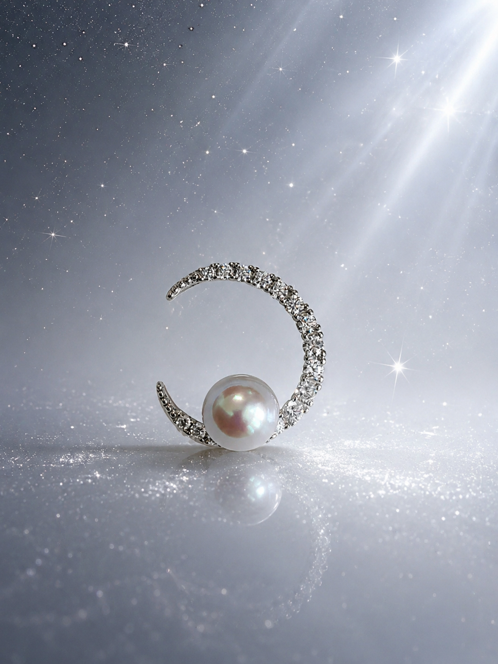 Silver crescent pearl pendant with round pearl centerpiece and pavé stones on chain