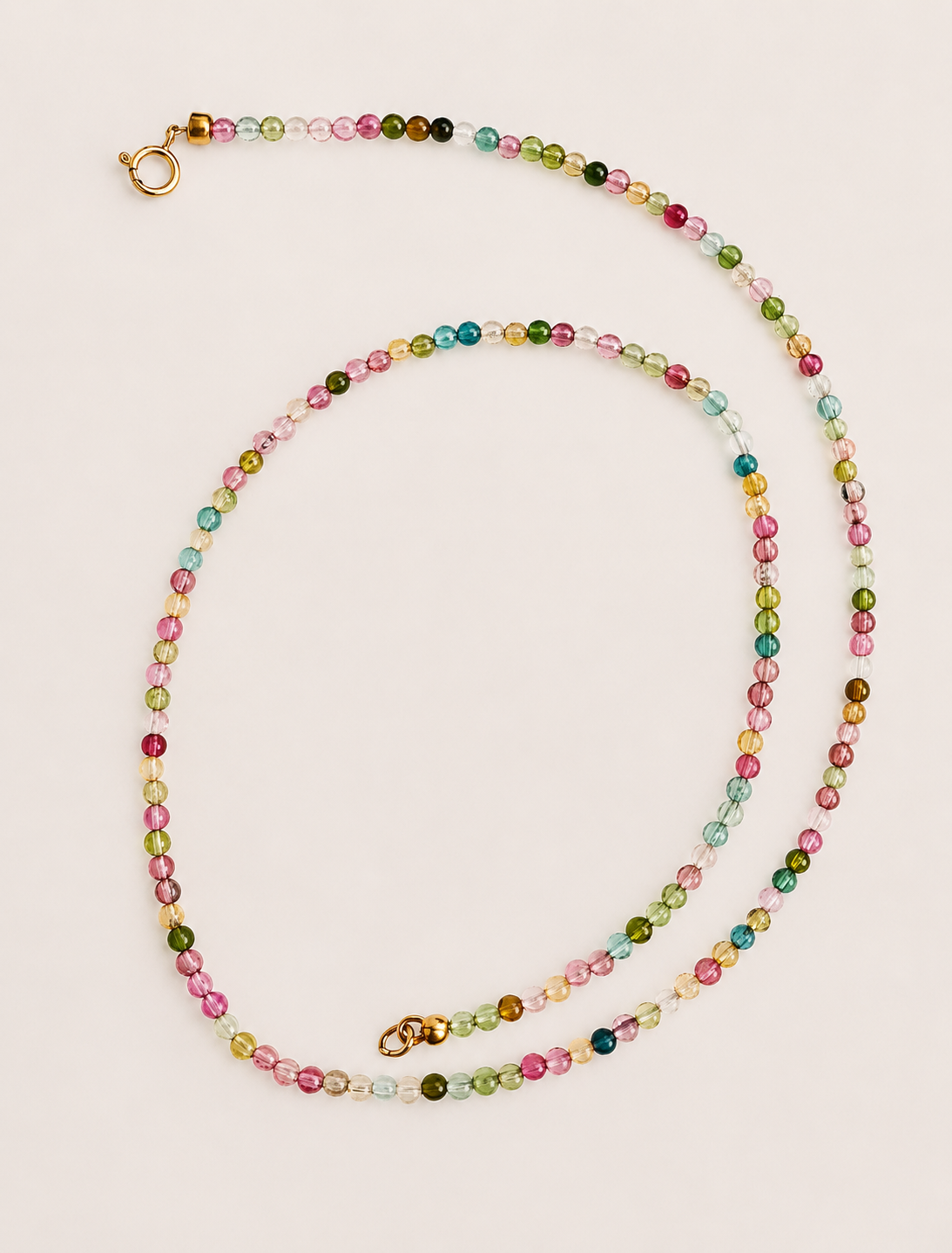 Rainbow beaded necklace strand with multicolor stones and gold clasp hardware