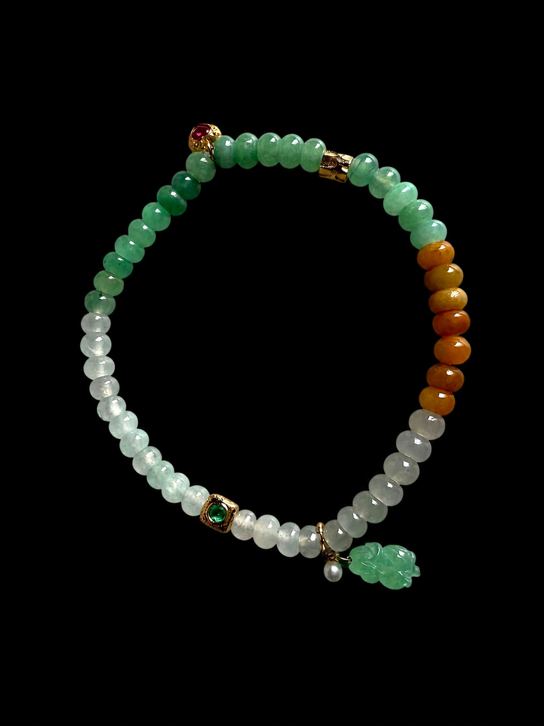 Jadeite bead bracelet with green and white beads, gold accents, and dangling green charm