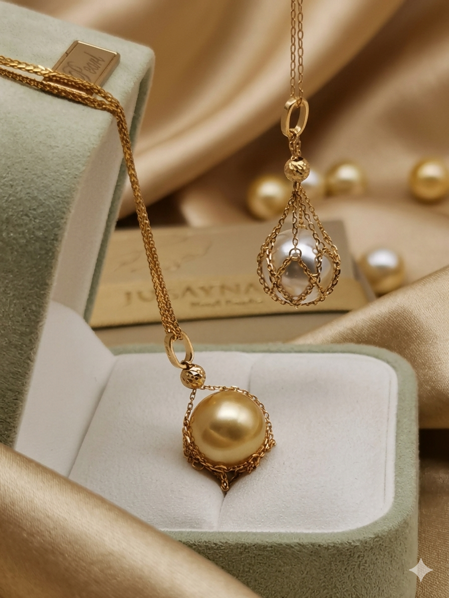 Gold pearl pendant necklace with teardrop net pearl, in jewelry tray