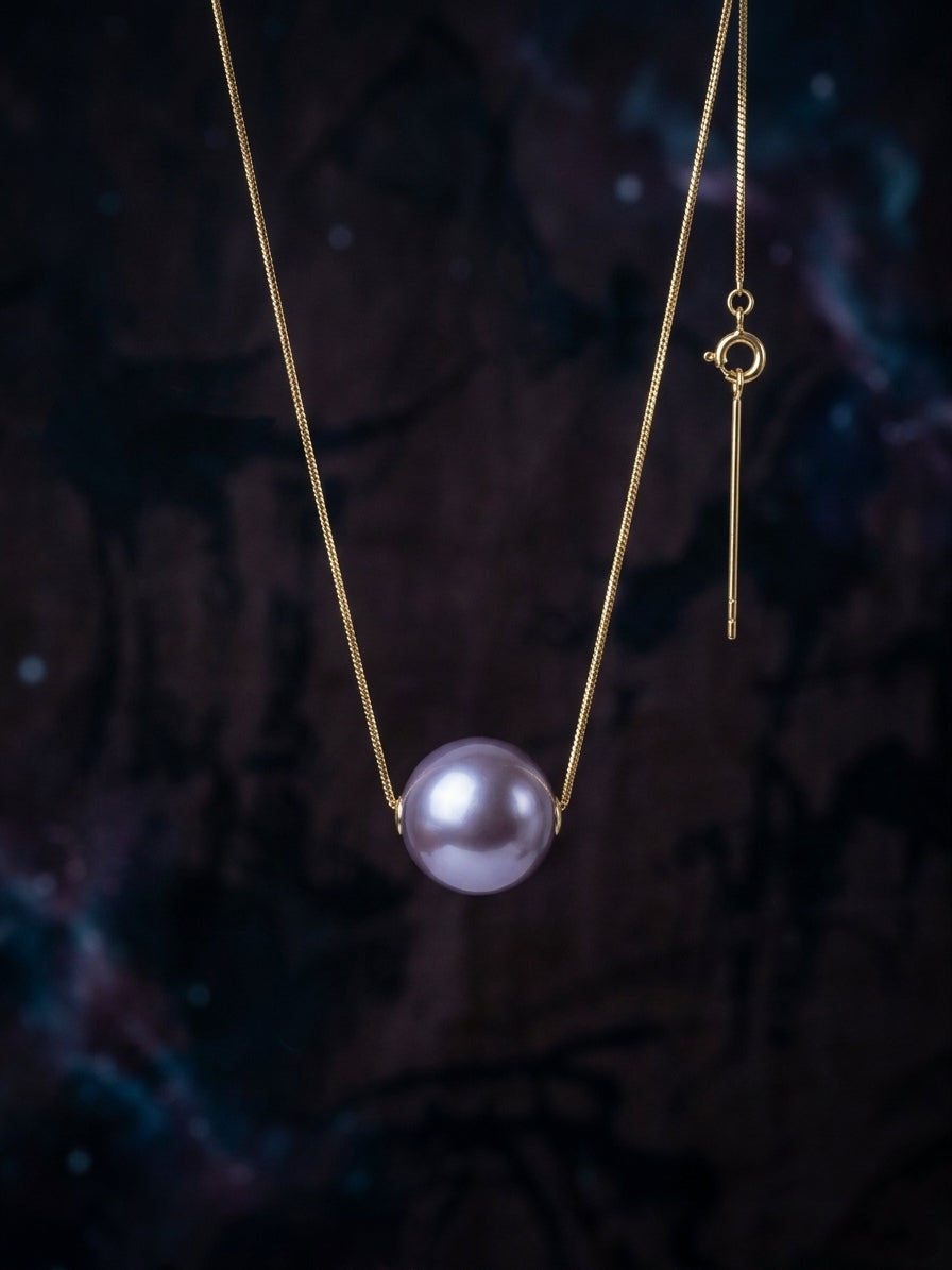 Gold chain necklace with purple pearl pendant and small loop clasp