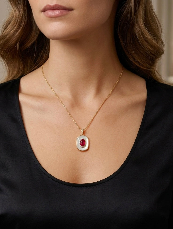 Ruby and mother-of-pearl pendant on a fine gold-tone chain necklace