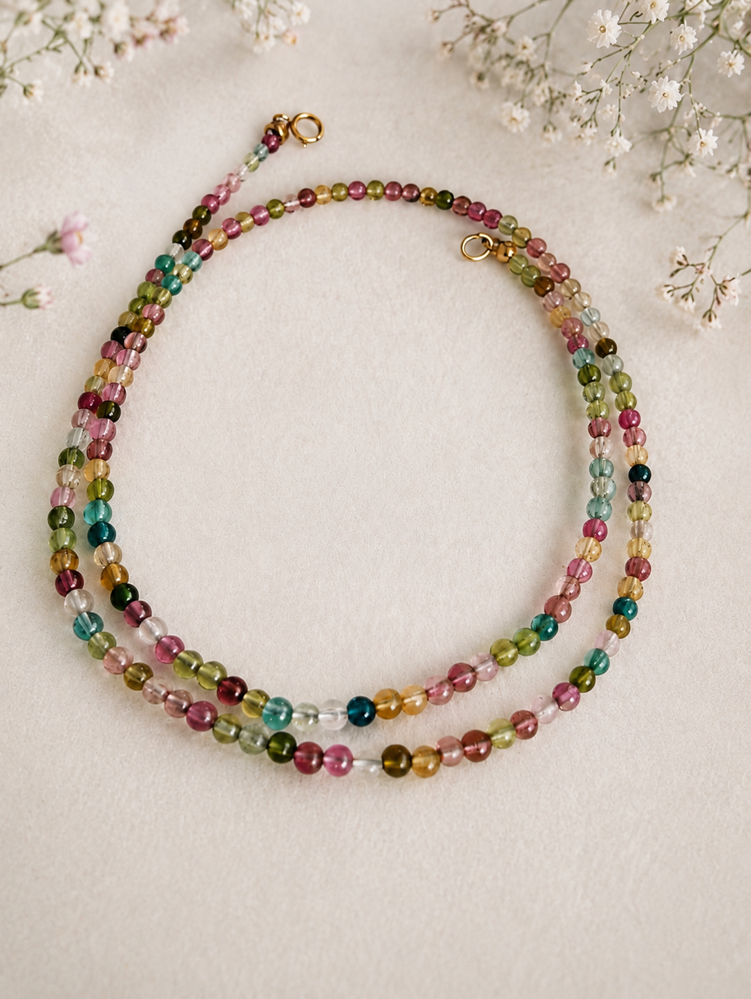 Rainbow tourmaline-style bead necklace with multicolor beads and gold clasp