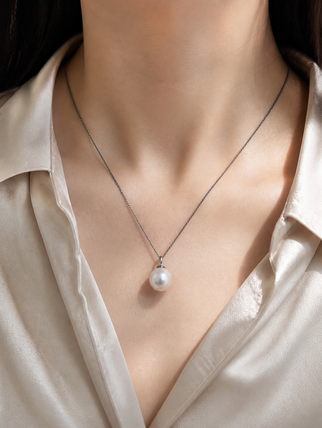 Pearl drop pendant on a thin chain necklace