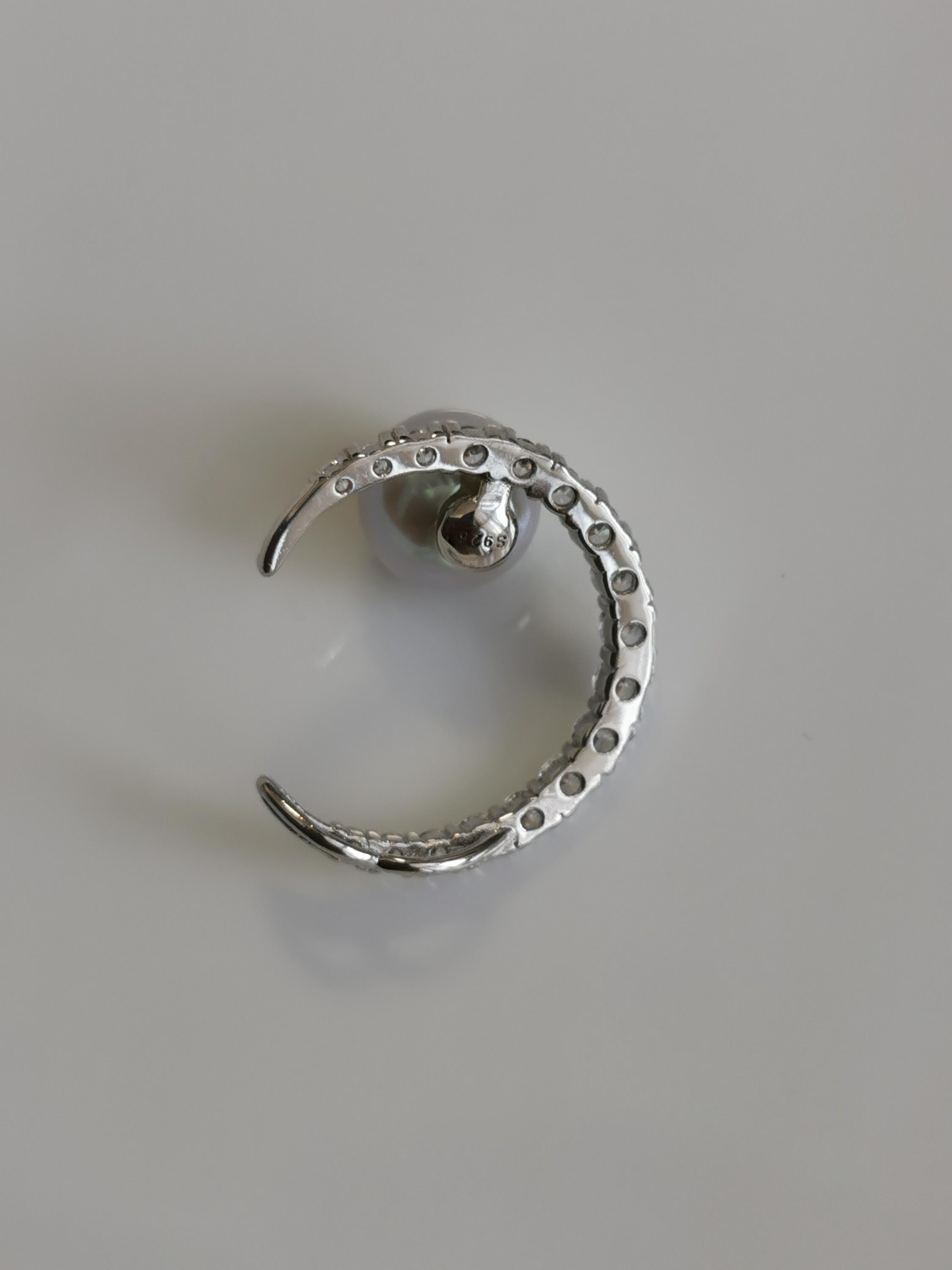 Silver crescent pearl pendant with small pavé stones and round pearl center