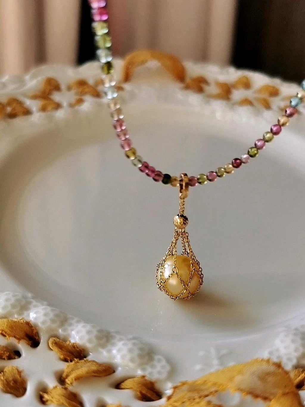 Gold teardrop pearl pendant necklace with multicolor bead chain