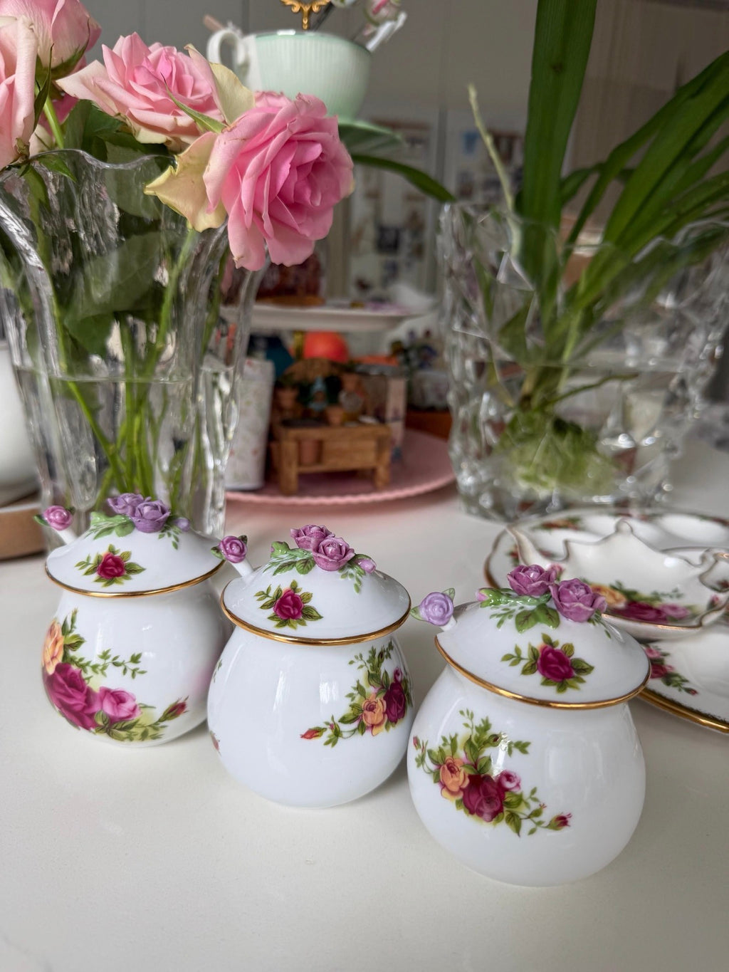 Porcelain sugar and salt jars with pink rose floral motifs and gold trim, arranged set