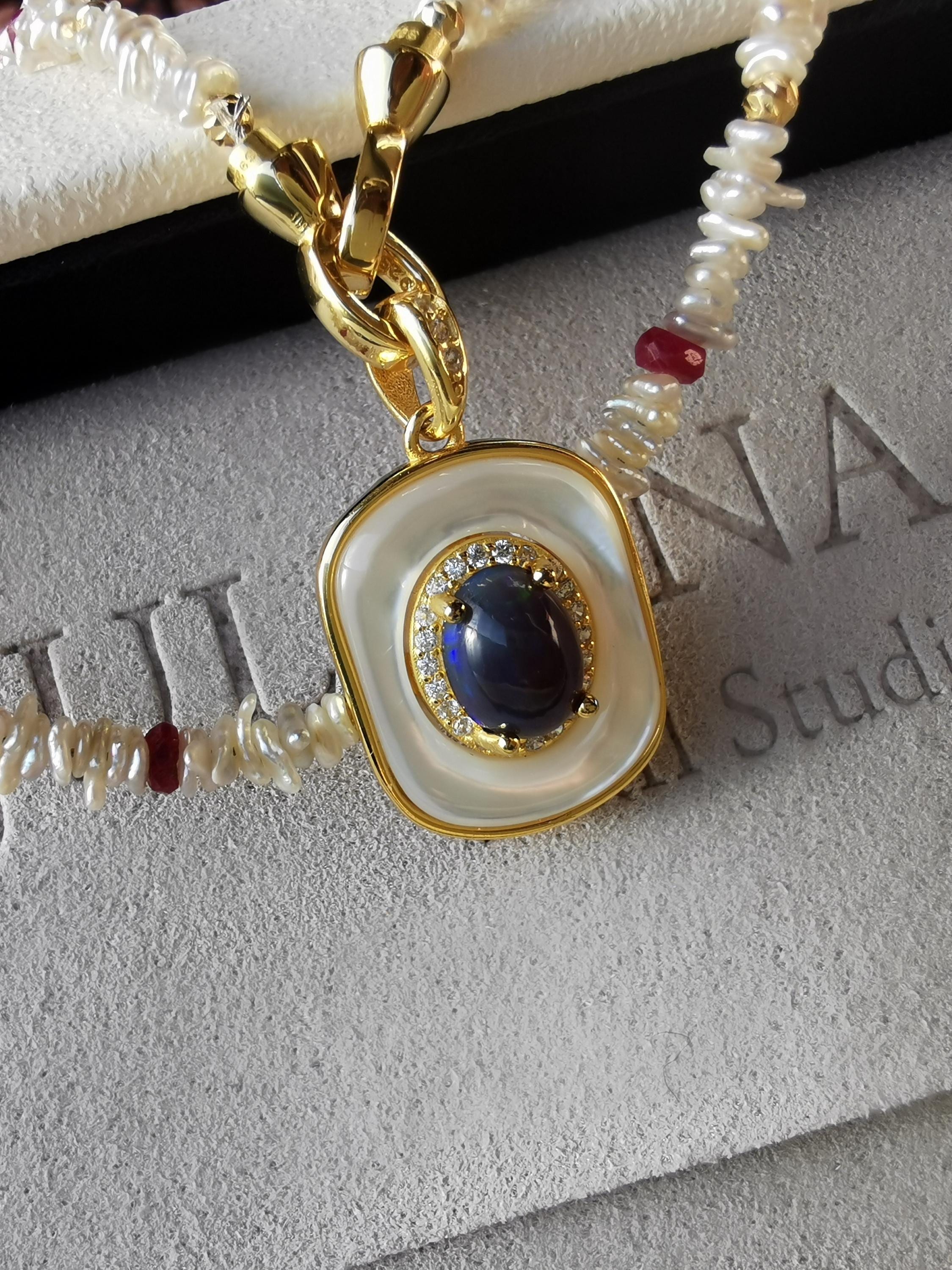 Pearl and red-bead necklace with blue opal-style pendant, gold-tone ring clasp