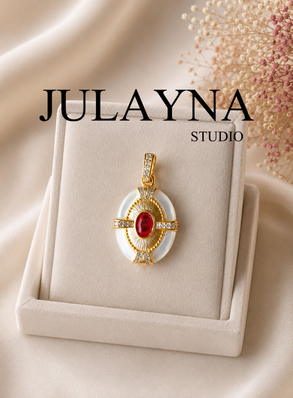 Gold oval pendant with mother-of-pearl bezel and red center stone