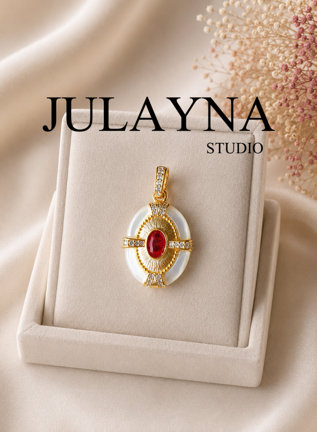 Gold oval pendant with mother-of-pearl bezel and red center stone