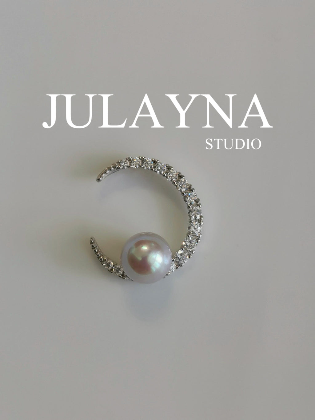 Silver crescent pearl pendant with round pearl and pavé stone halo
