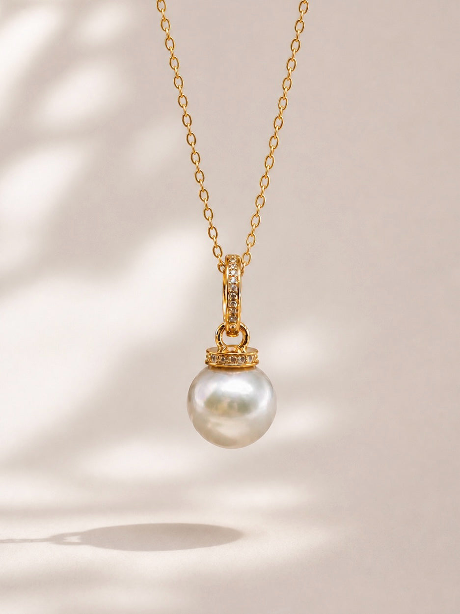Gold pendant necklace with round South Sea pearl and pavé halo bail