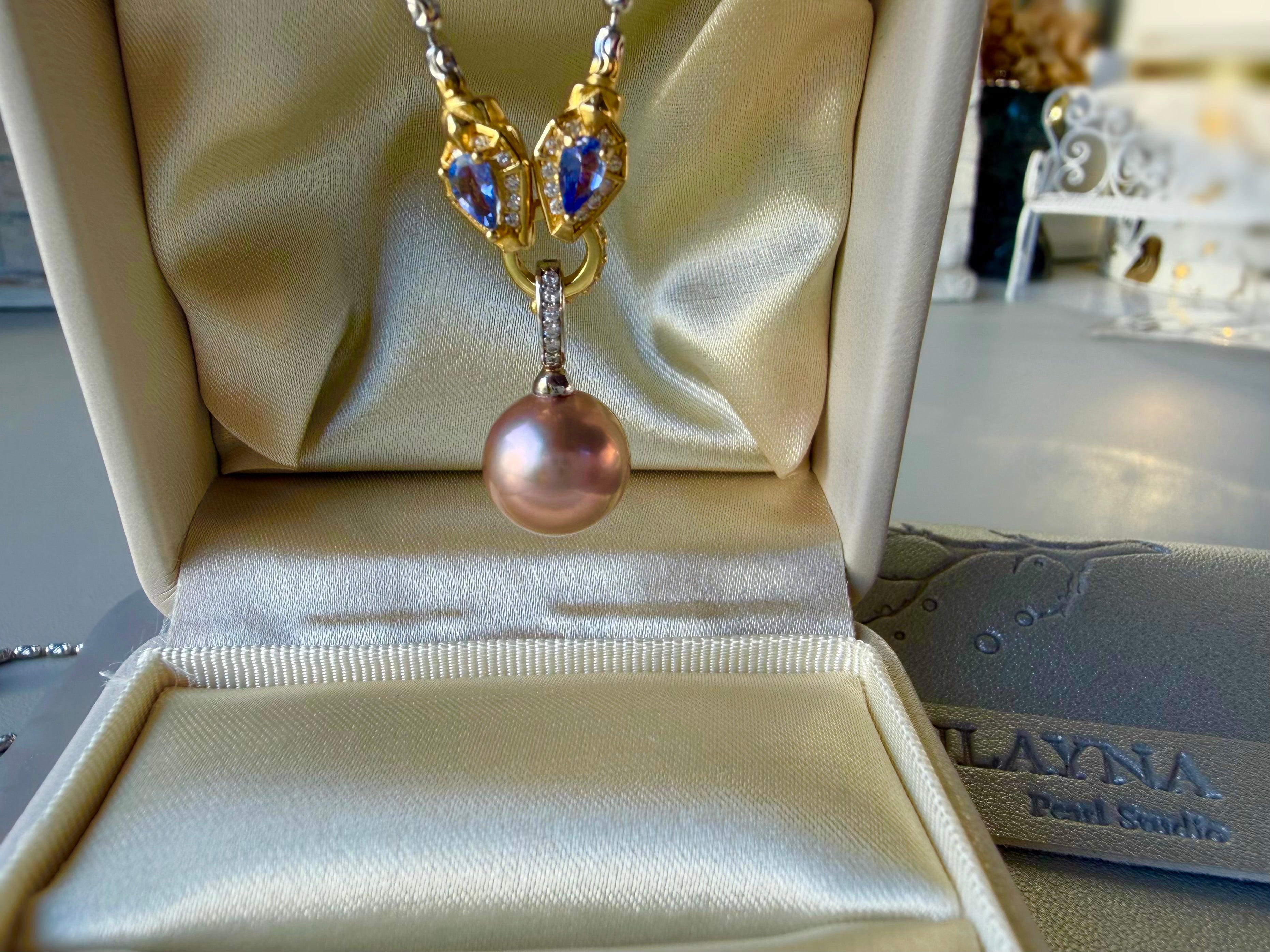Rainbow tourmaline bead necklace with rose-pink pearl pendant on display