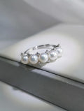 Adjustable silver pearl ring with five white freshwater pearls and crystal details
