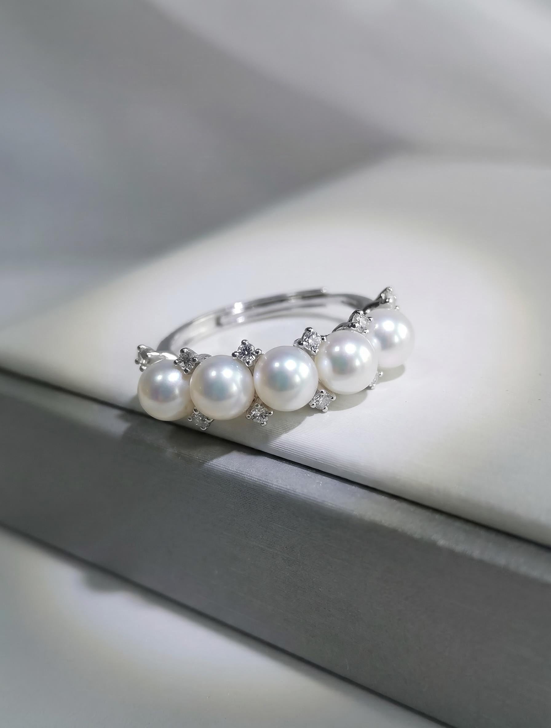 Adjustable silver pearl ring with five white freshwater pearls and crystal details