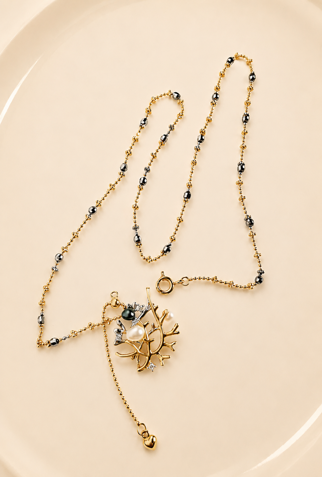 Layered beaded necklace with small pearl-like accents and dangling star charm