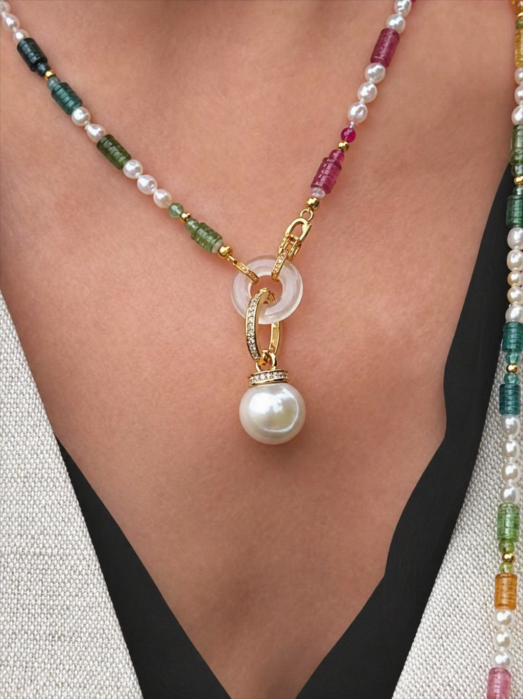 Gold South Sea pearl pendant on a multicolor bead necklace with gemstone bail