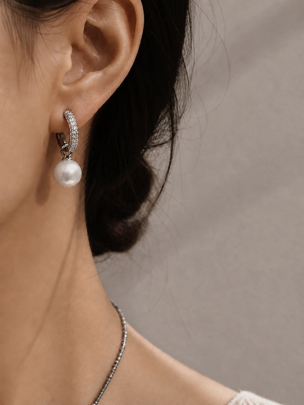 Silver hoop lock earrings with textured pavé hoops and lustrous round pearl drops