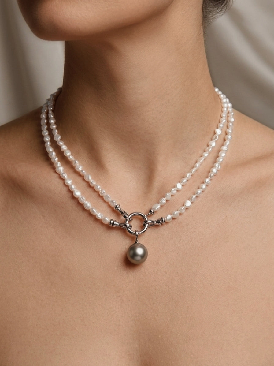 Keshi pearl beaded necklace with double strands and dark pearl drop center