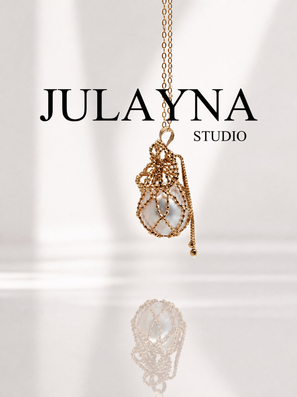 Gold net pouch pendant with South Sea pearl on long necklace chain
