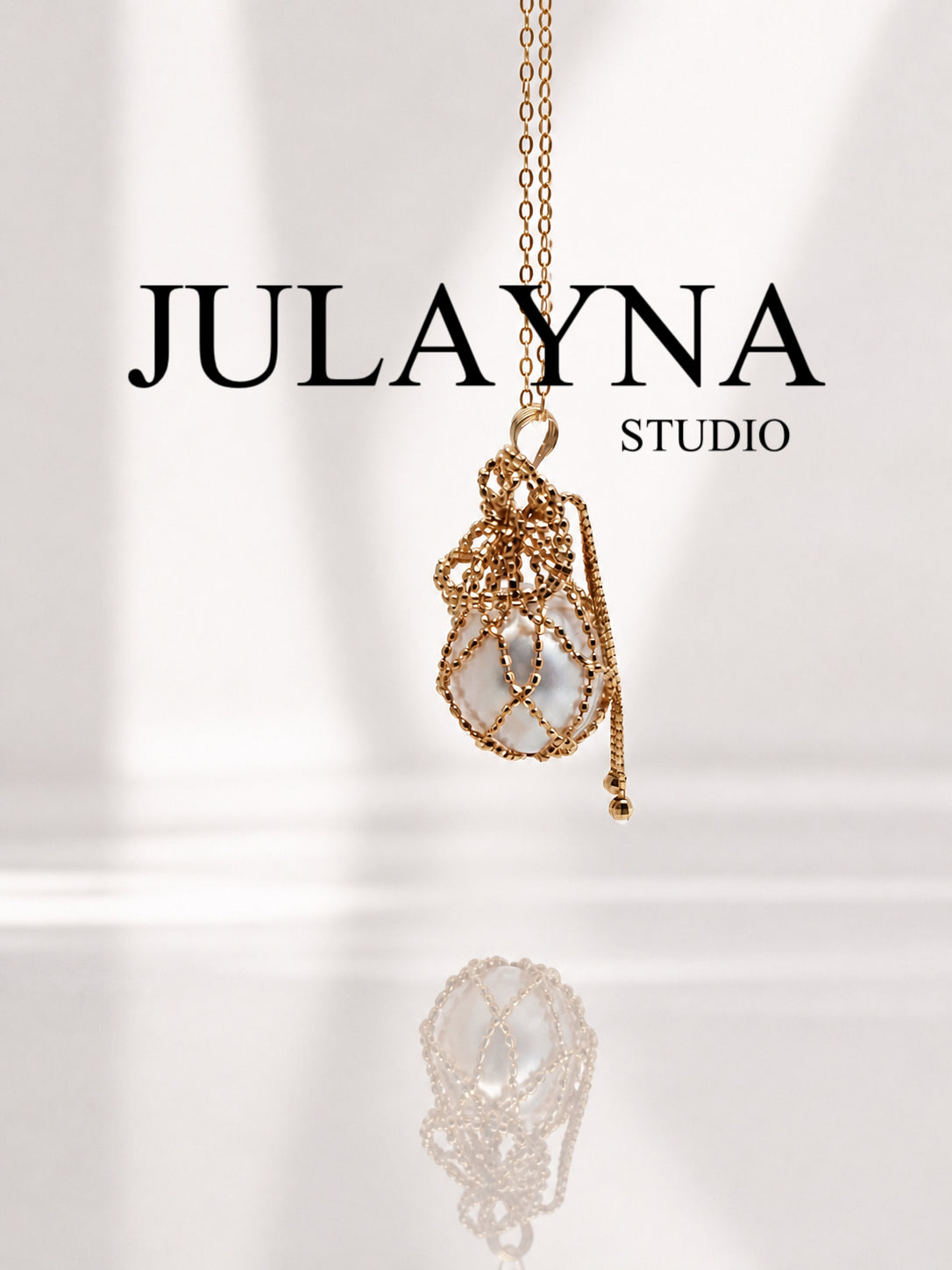 Gold net pouch pendant with South Sea pearl on long necklace chain