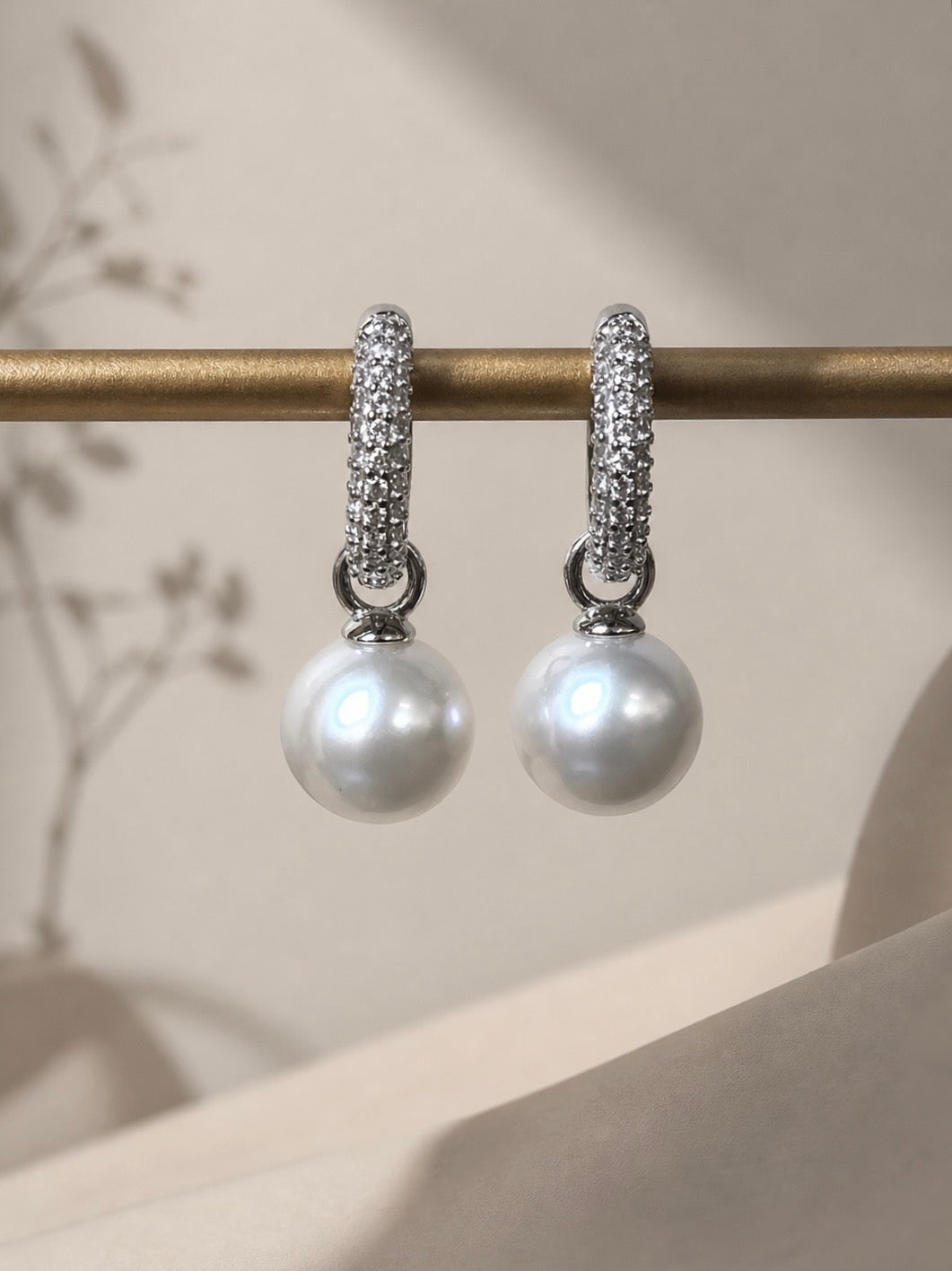 Silver hoop lock earrings with pavé top hoops and round pearl dangles