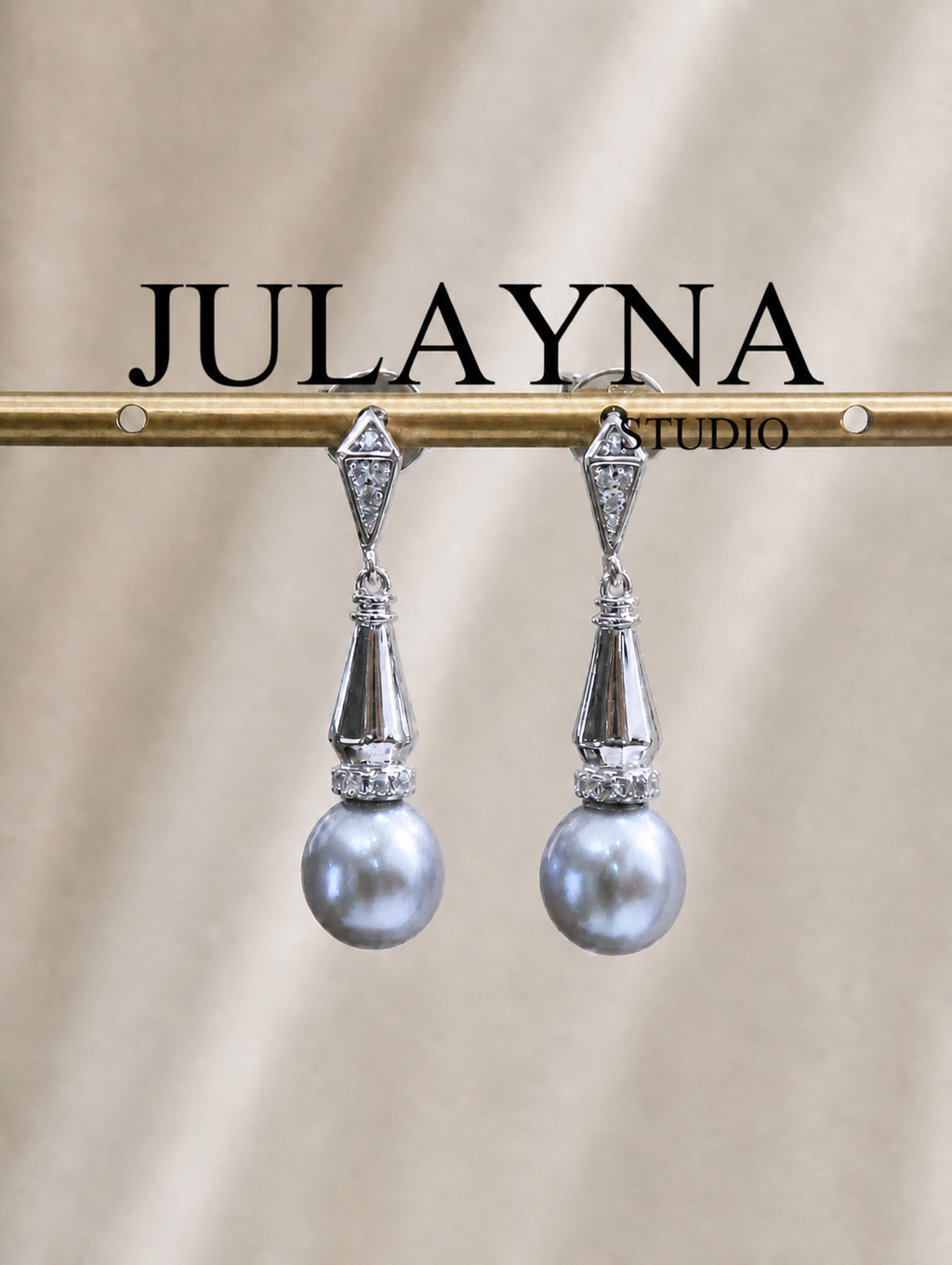 Silver-tone dangle earrings with faceted connectors and gray teardrop pearls