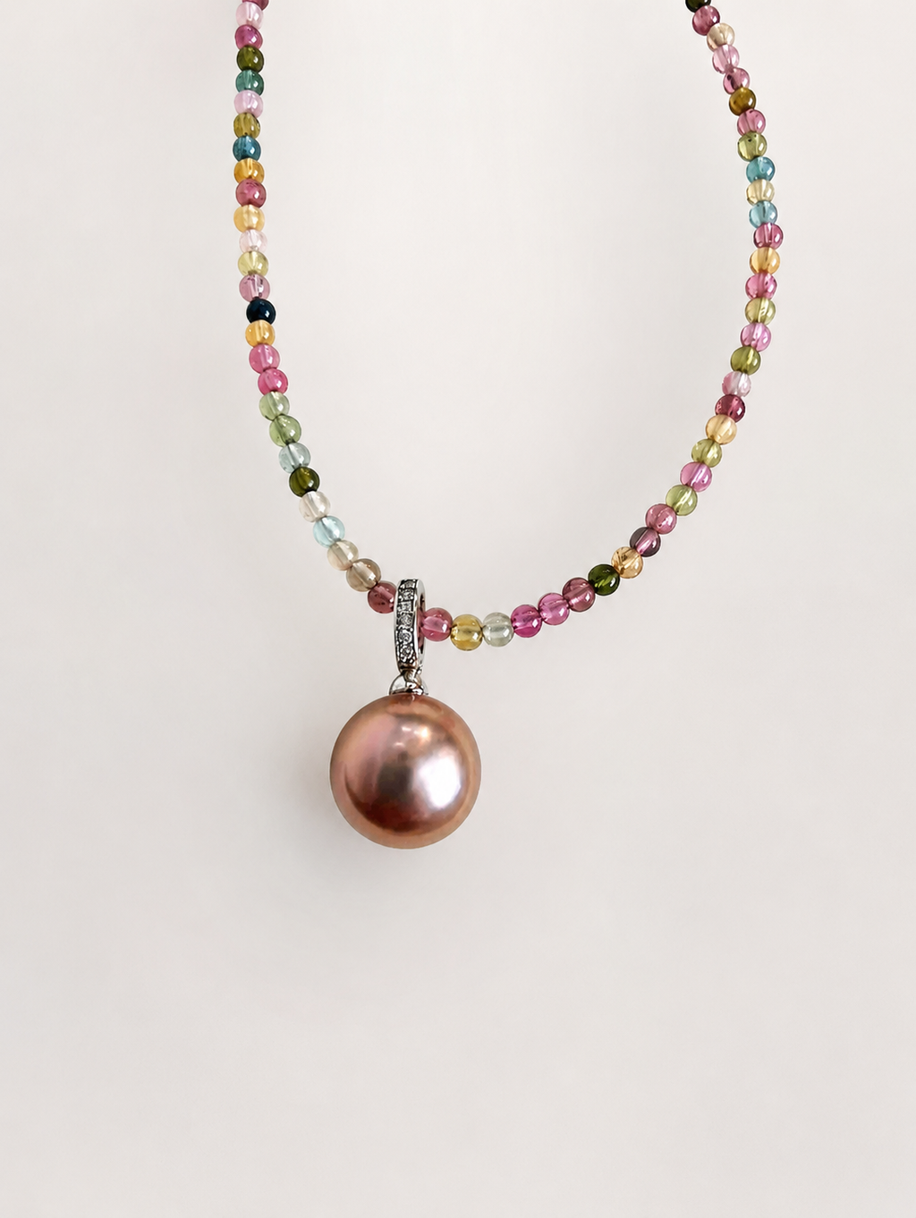 Rainbow beaded necklace with multicolor stones and a pink round pearl pendant