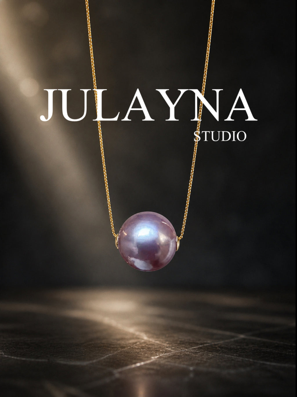 Gold necklace with purple pearl drop pendant on a fine chain