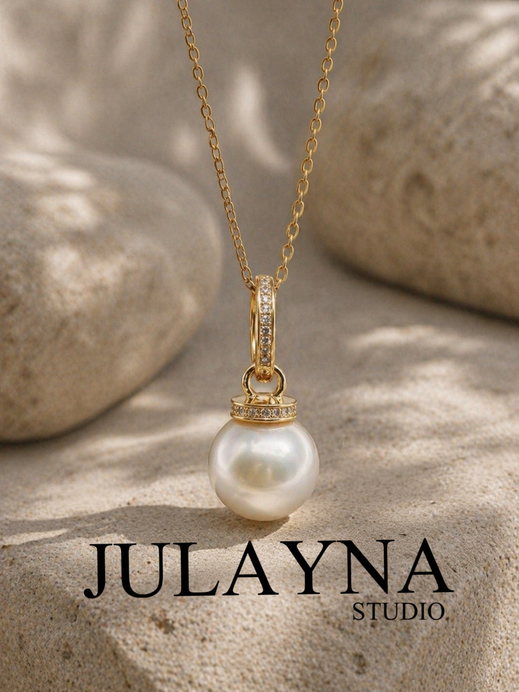 Gold-tone South Sea pearl pendant on chain with crystal bezel accents