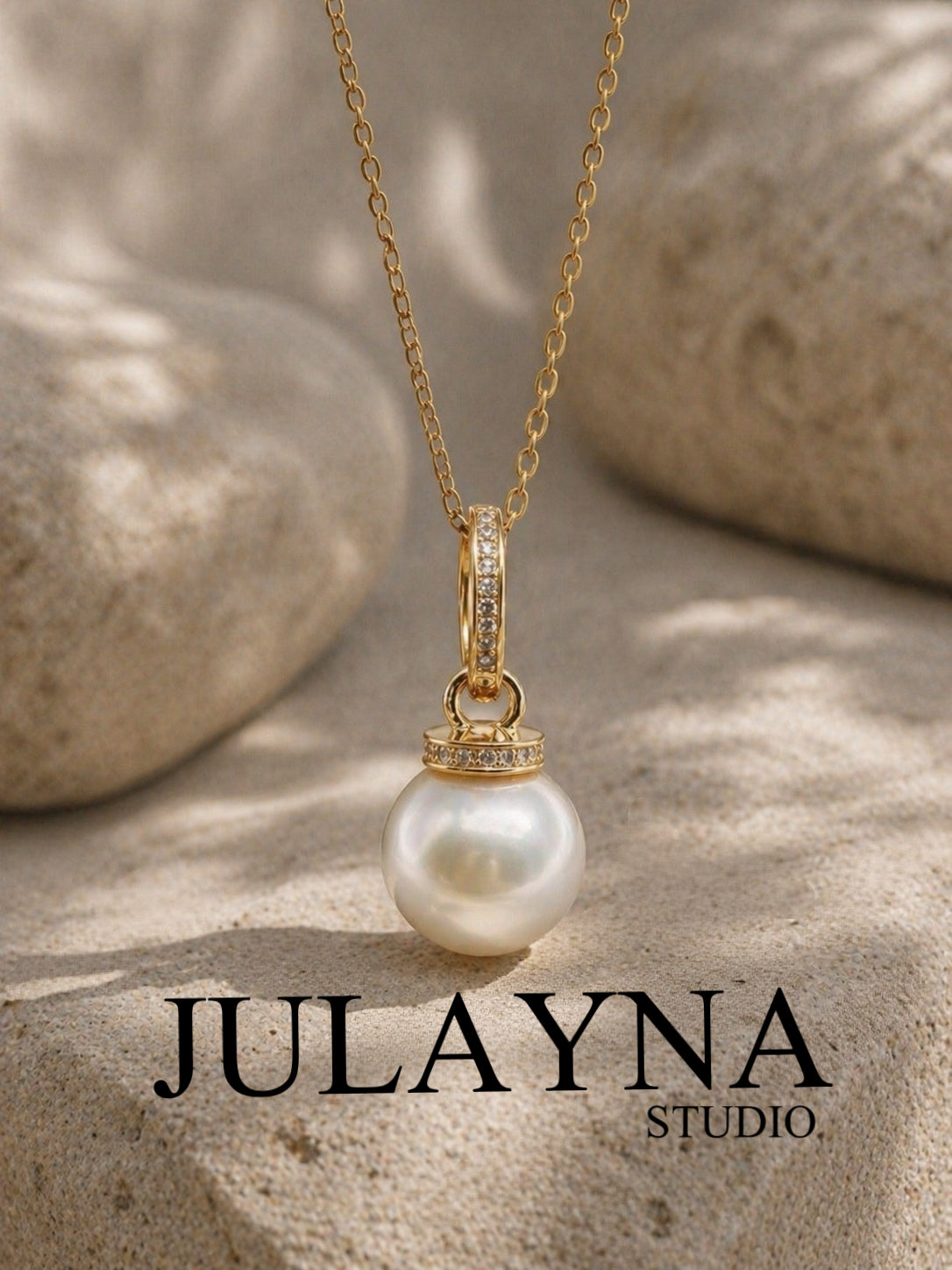 Gold-tone South Sea pearl pendant on chain with crystal bezel accents