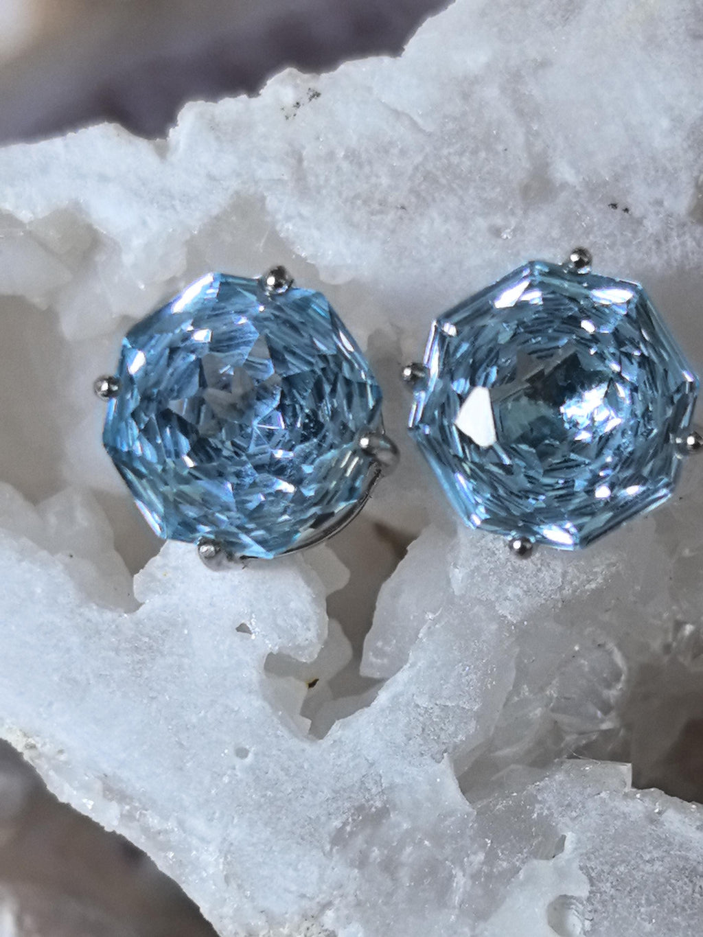 Blue topaz stud earrings on white crystals, large faceted round stones in bezels