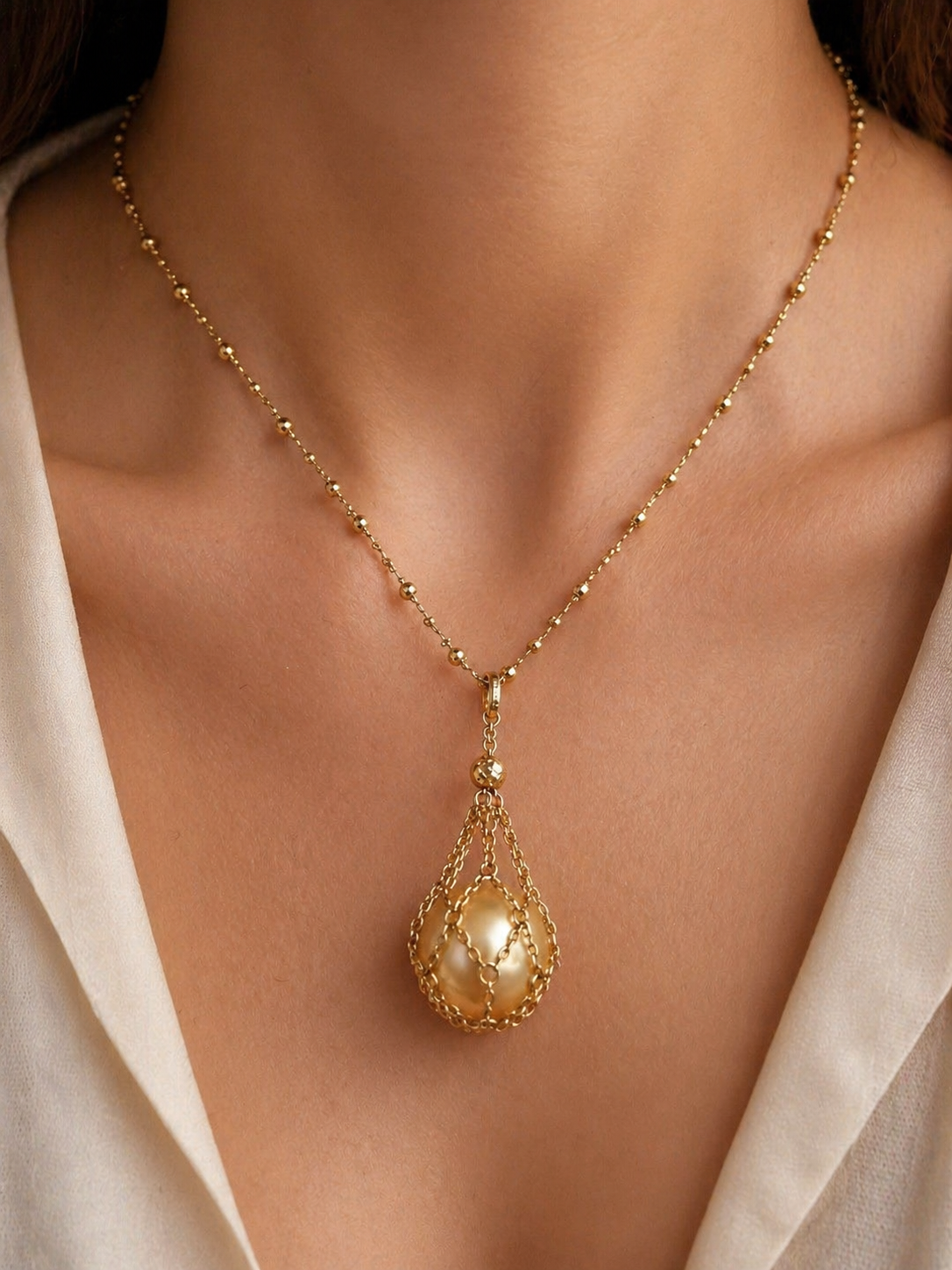 18k gold net pendant necklace with teardrop pearl pendant on fine chain