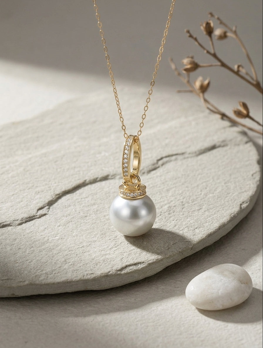 Gold-tone South Sea pearl pendant on chain with pavé oval frame