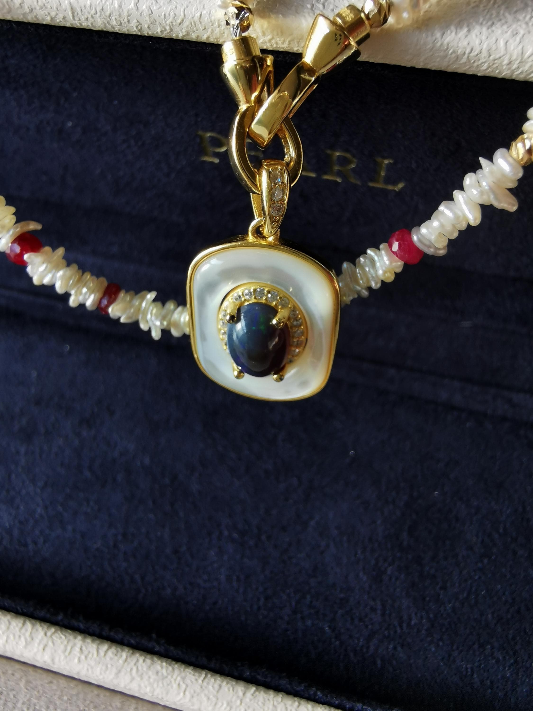 Pearl and red-bead necklace with blue opal-style pendant, gold-tone frame