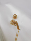 18K solid gold net pouch pendant with golden pearl on gold chain close-up