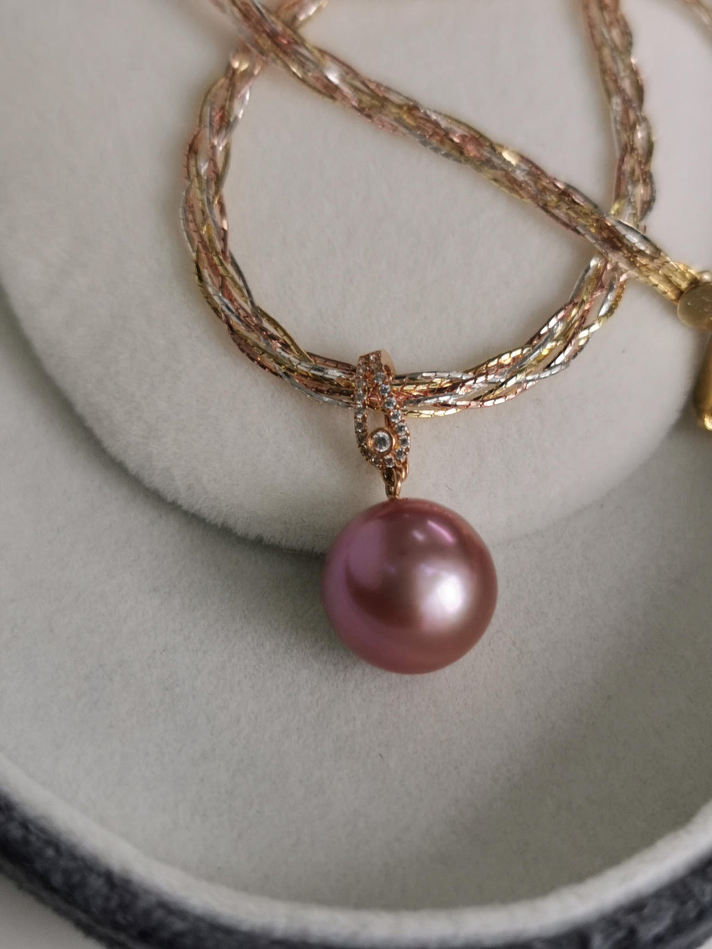 Diamond-set gold pearl pendant with large purple pearl on layered chain