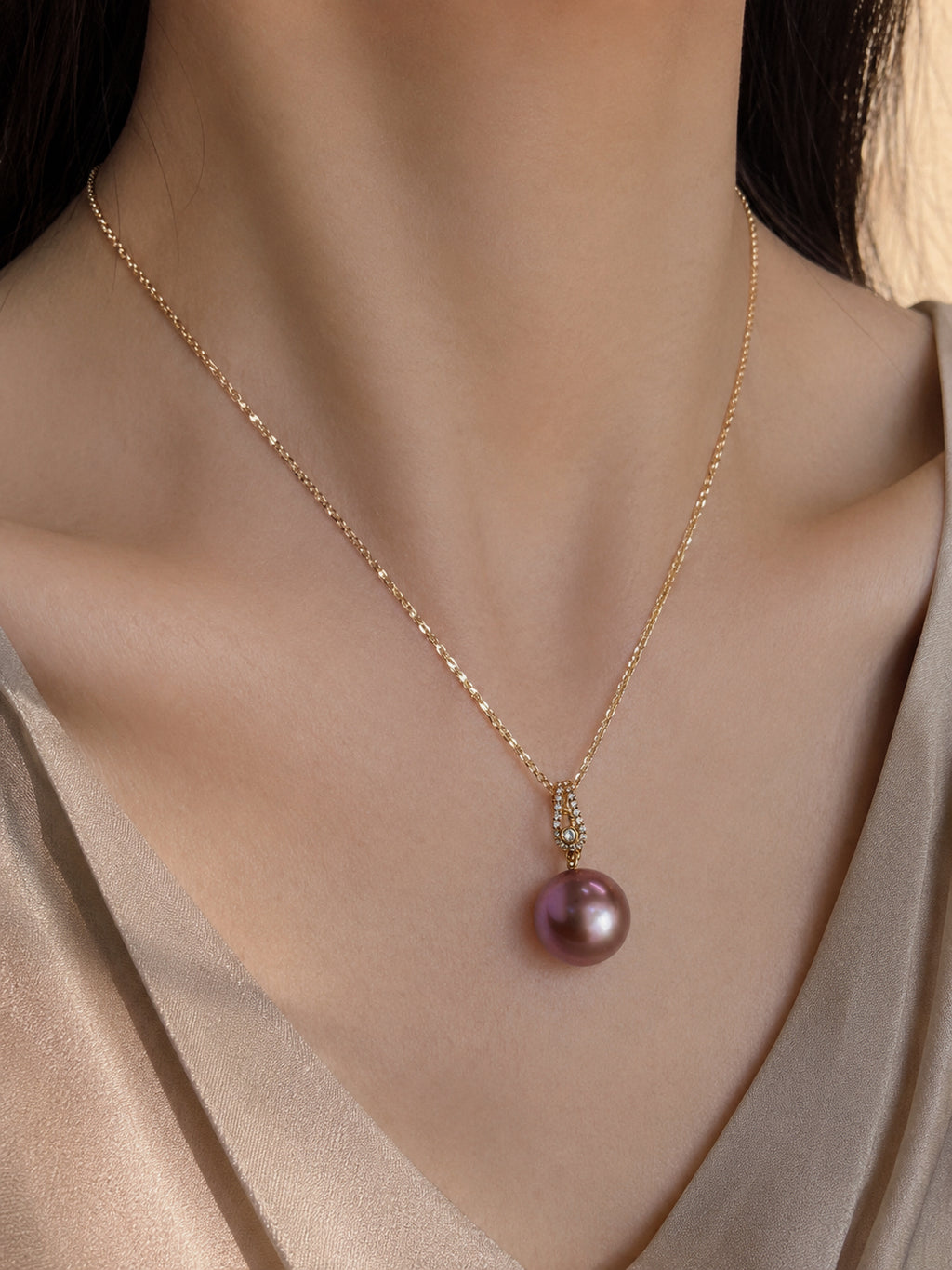 Gold pendant necklace with purple pearl drop and small diamond-set bail