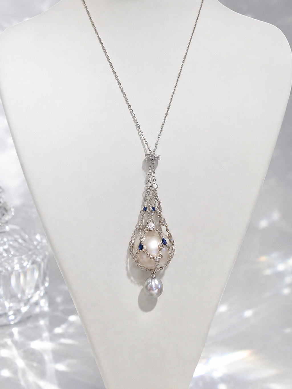 Pendant necklace with openwork teardrop pendant and dangling pear-shaped pearl