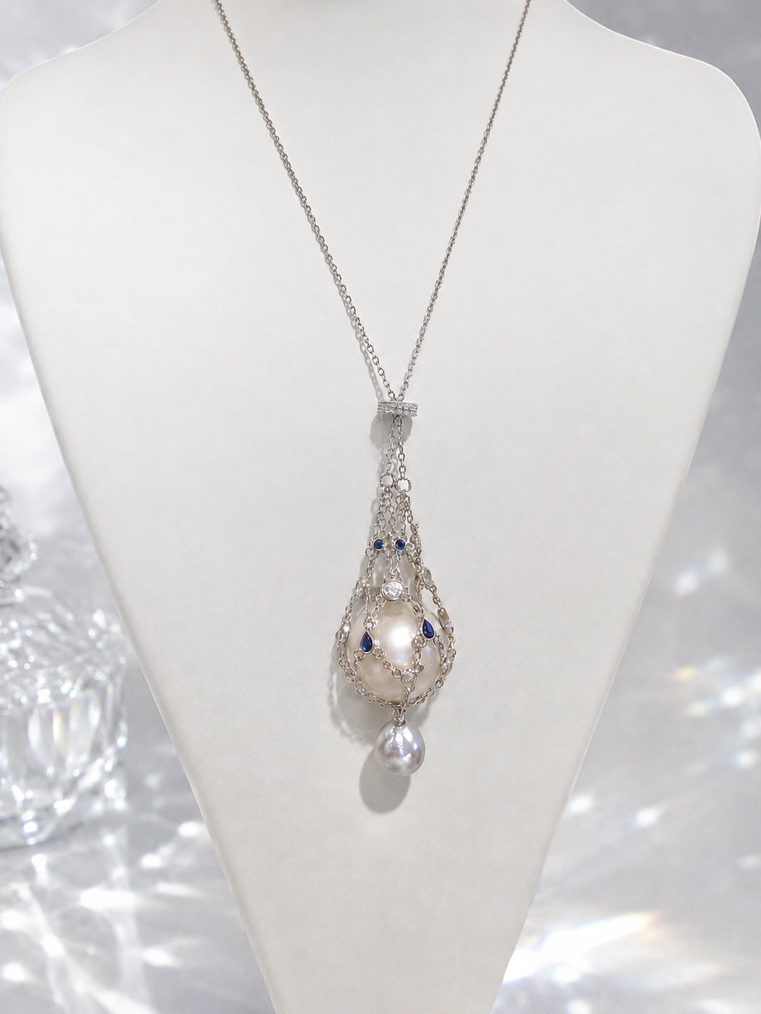 Pendant necklace with openwork teardrop pendant and dangling pear-shaped pearl