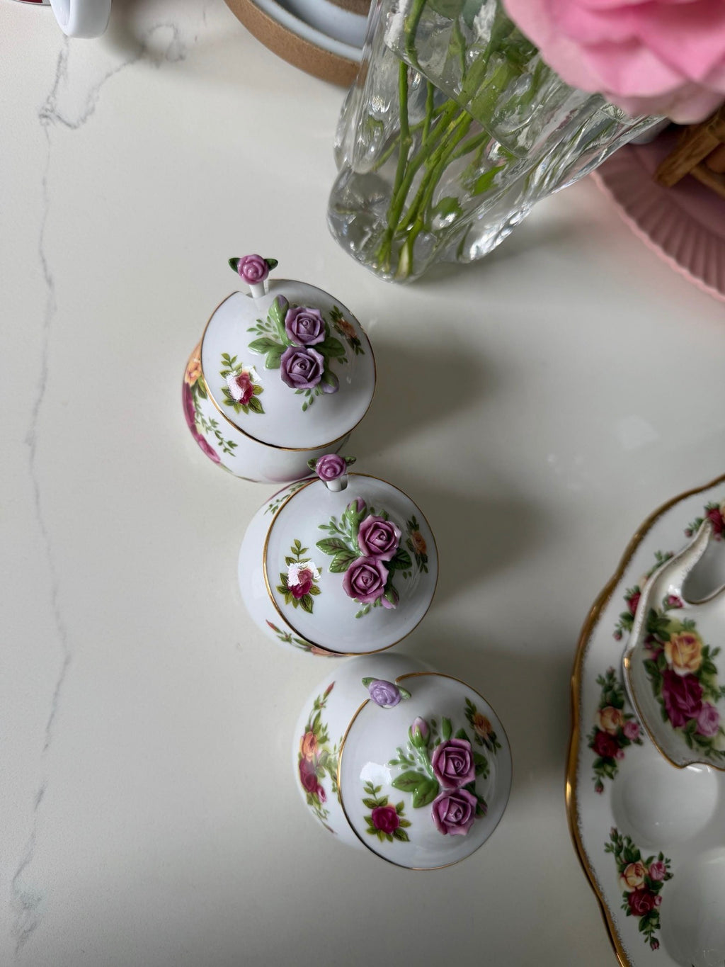 Porcelain sugar and salt jar lids with purple and pink rose floral designs and gold edging