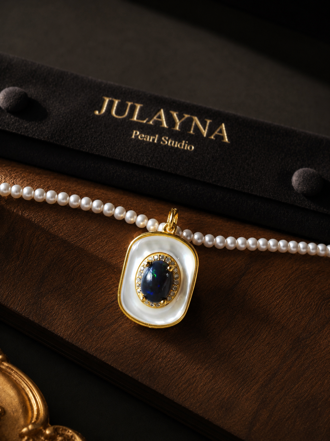 Pearl necklace with blue opal-style square pendant in gold-tone bezel