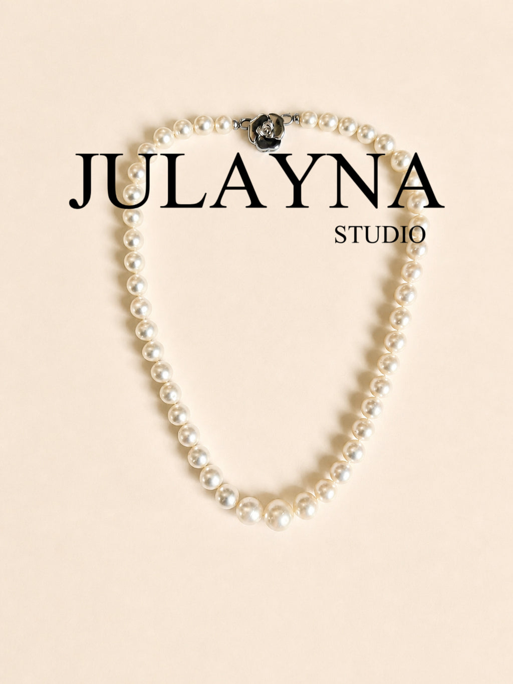Classic South Sea pearl necklace with round white pearls and a black accent bead clasp