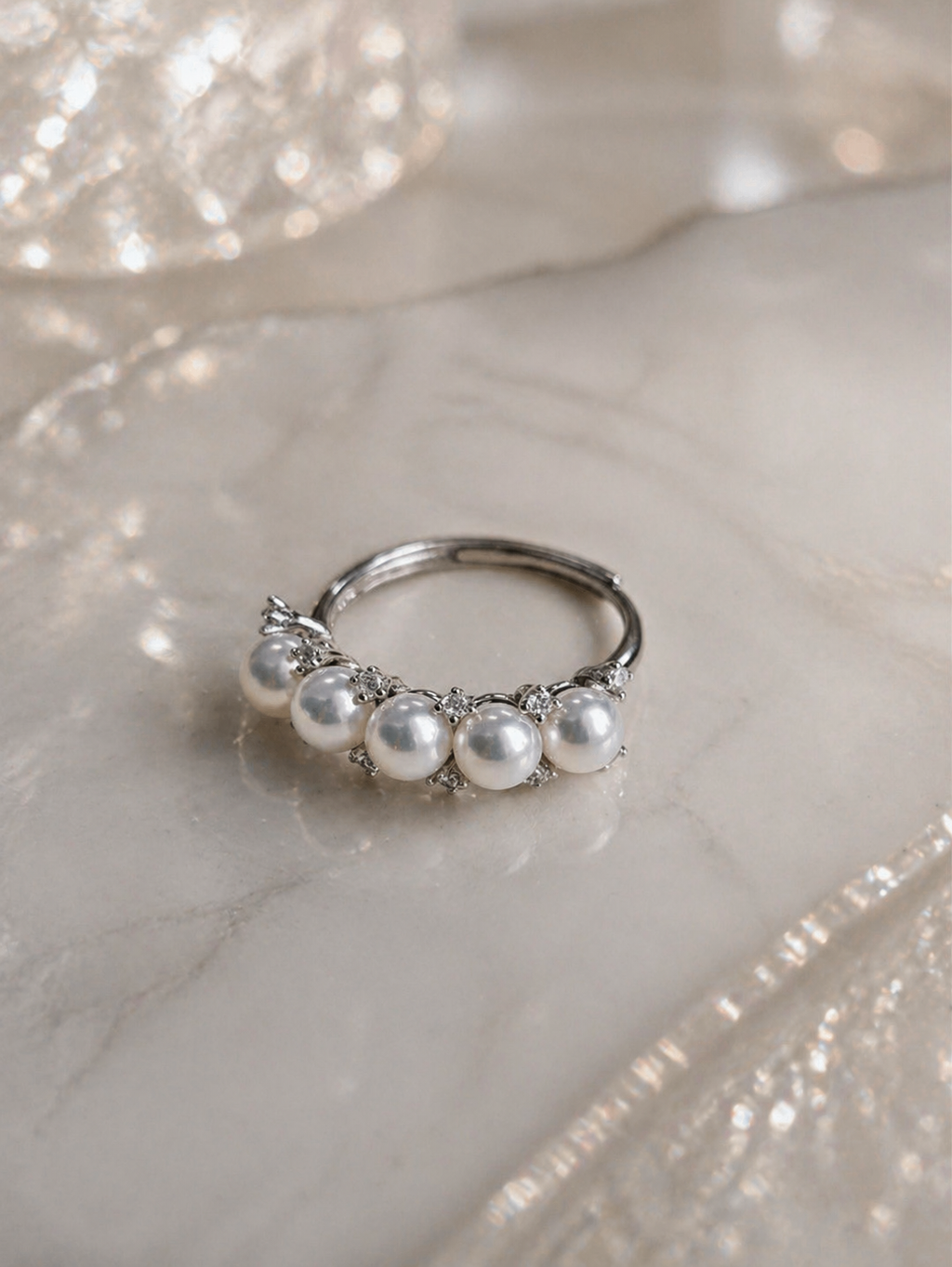 Adjustable silver ring with five white freshwater pearls and rhinestone accents