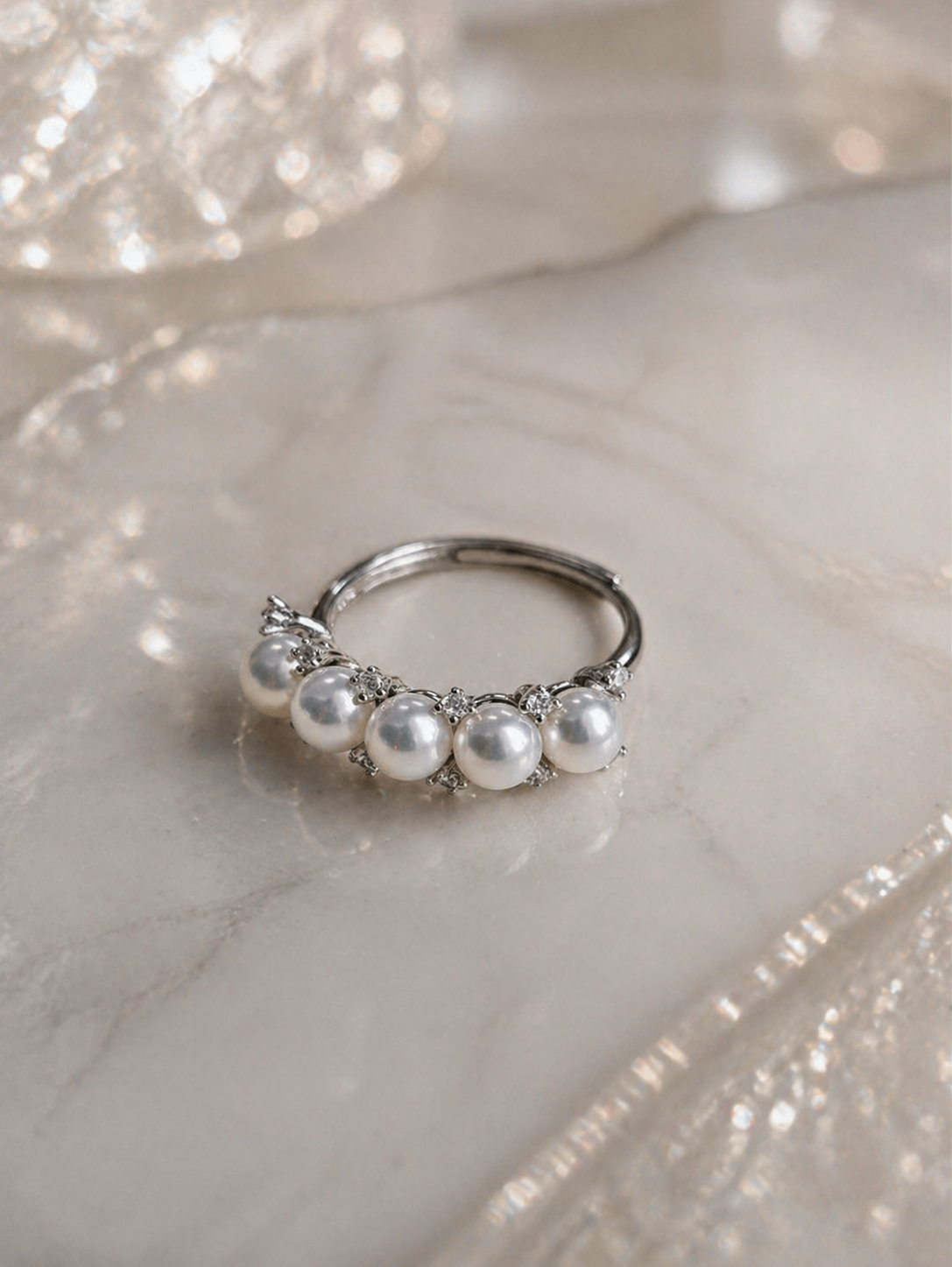 Adjustable silver ring with five white freshwater pearls and rhinestone accents