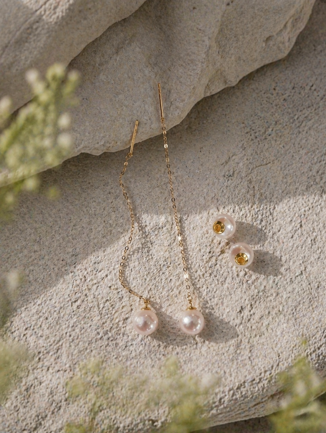 Long threader pearl earrings with gold-tone backs, pearl drops, and long chains