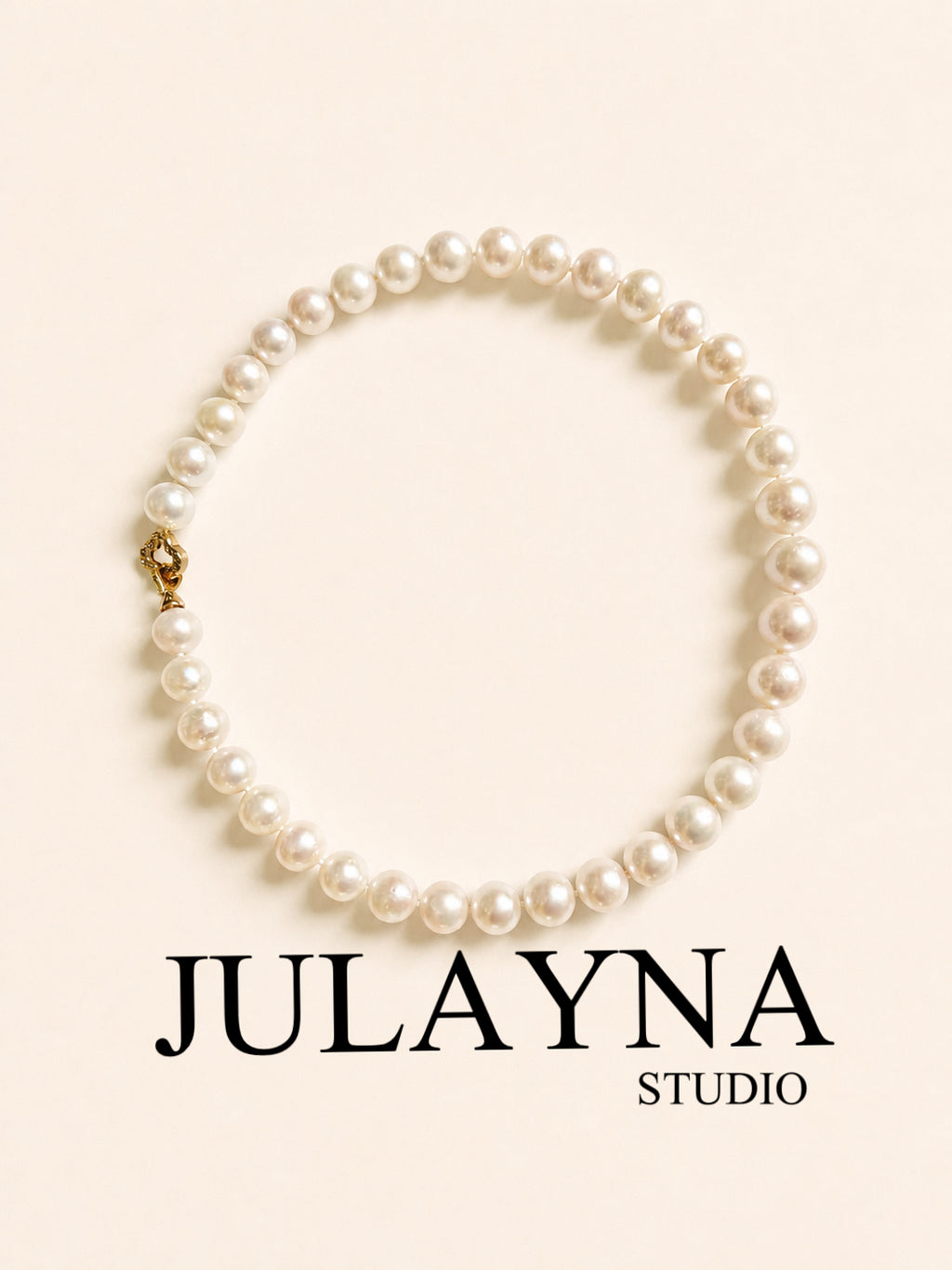 All-nacre pearl necklace with round white pearls and a gold-tone clasp