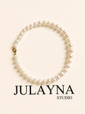 All-nacre pearl necklace with round white pearls and a gold-tone clasp