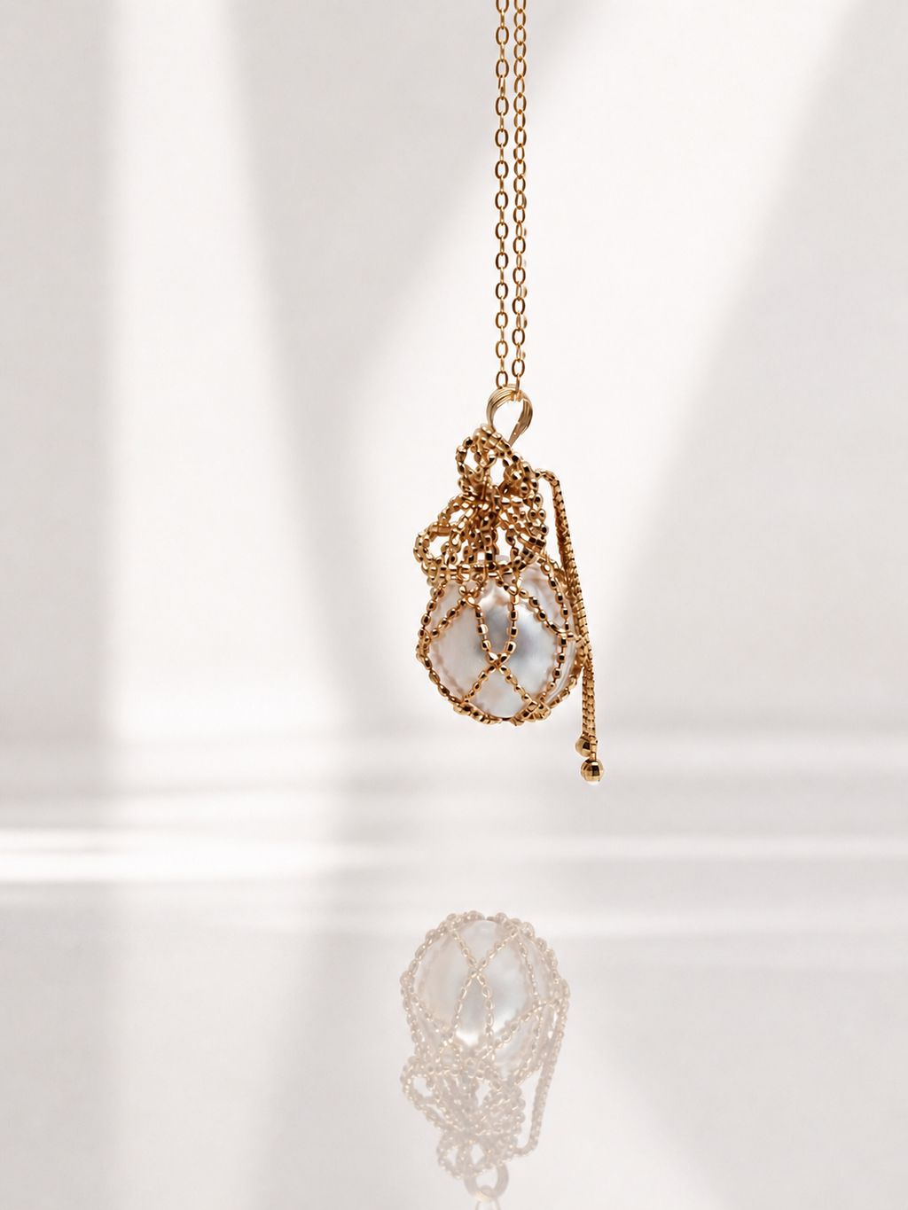 18K solid gold net pouch pendant on gold chain with small dangling charm